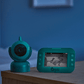 Mint green baby video monitor showing live view on screen with camera unit