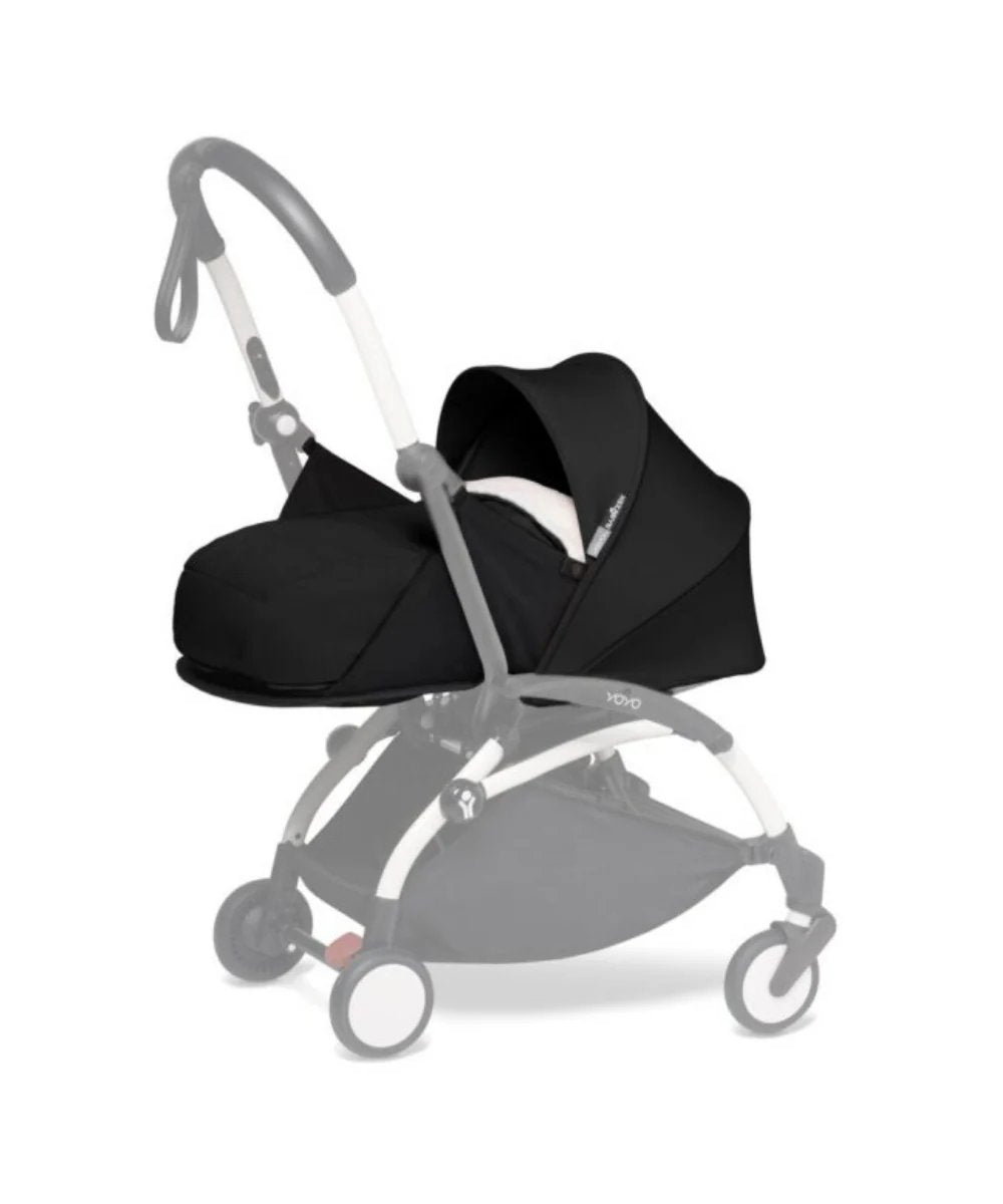 Black newborn stroller seat pack with canopy and harness, front view