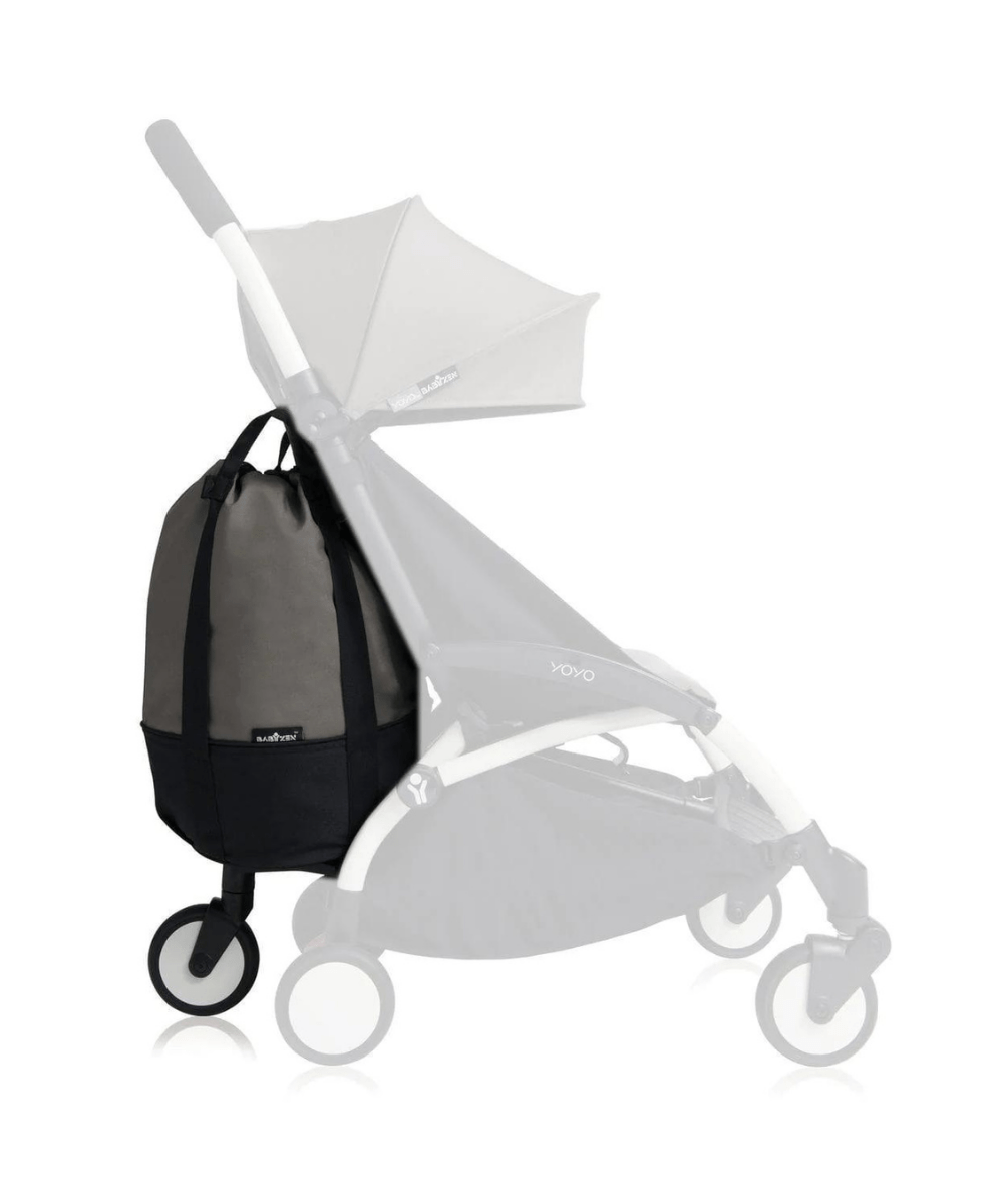 Stroller bag hanging on a white stroller, grey body with black base panel