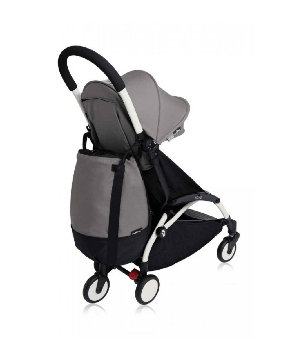 Stroller bag in grey and black attached to a compact stroller with straps