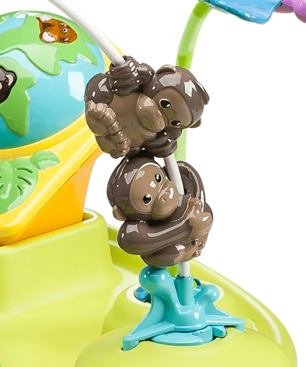 Grey animal toy figure on blue base inside green bouncing saucer