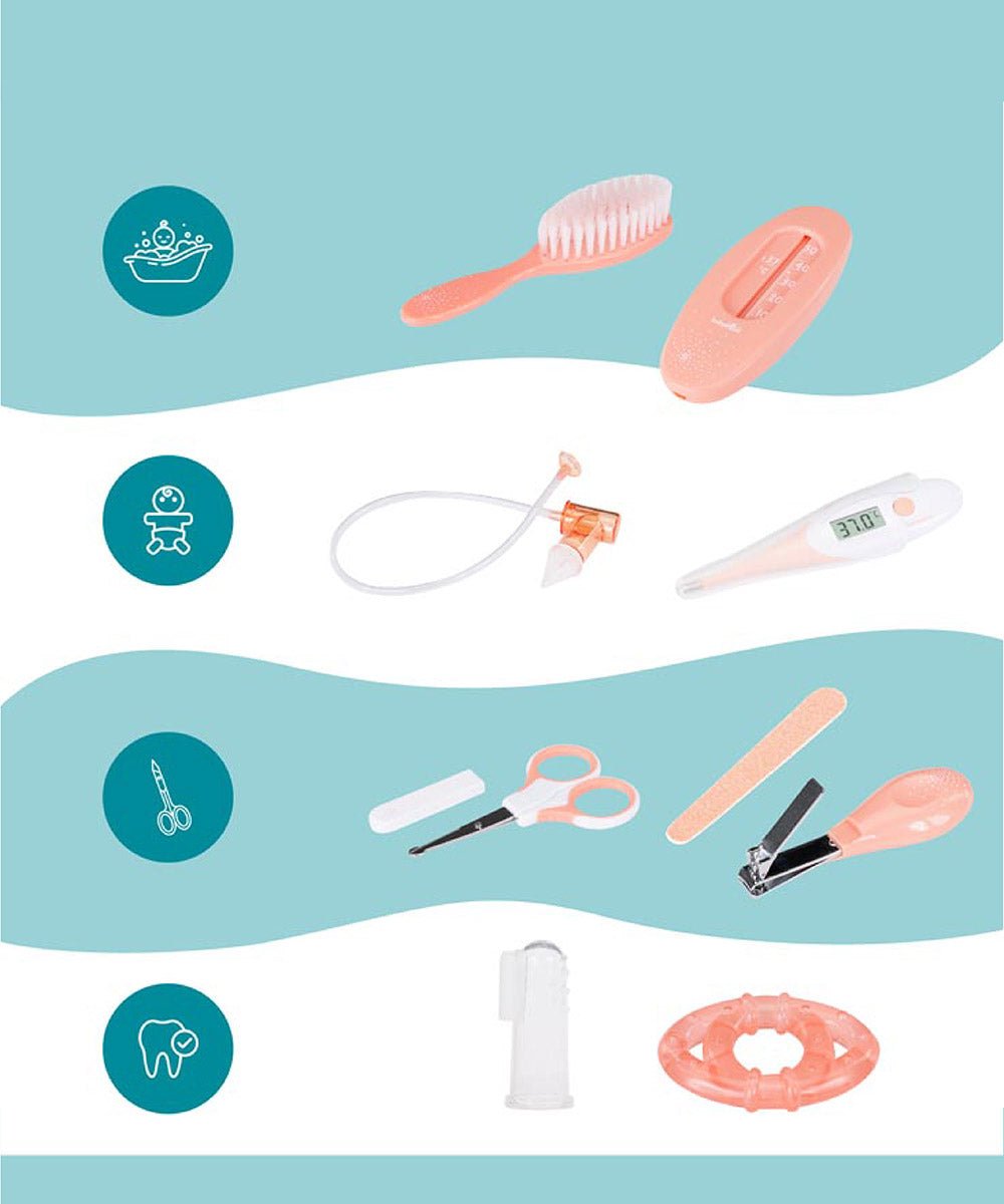 Assorted baby grooming tools in pink and white, including brush, comb, scissors, and file
