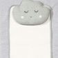 Gray changing mattress with close-up cloud face appliqué and eyelash detail.