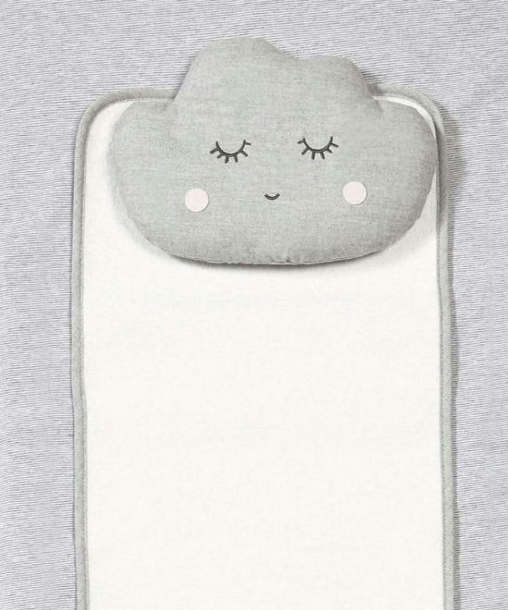 Gray changing mattress with close-up cloud face appliqué and eyelash detail.