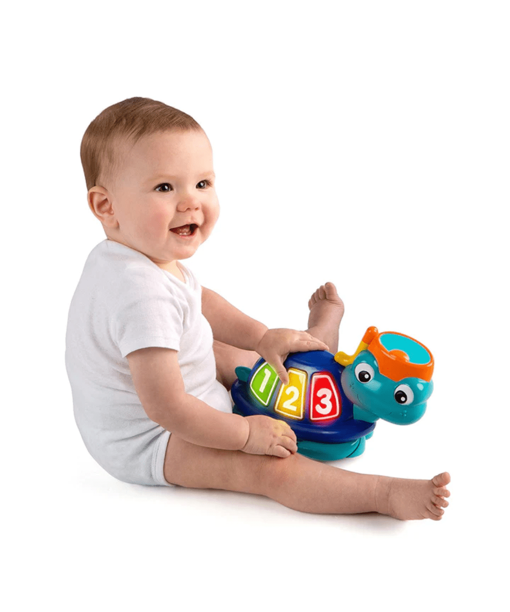 Neptune’s Ocean jumper activity toy with smiling baby sitting and reaching