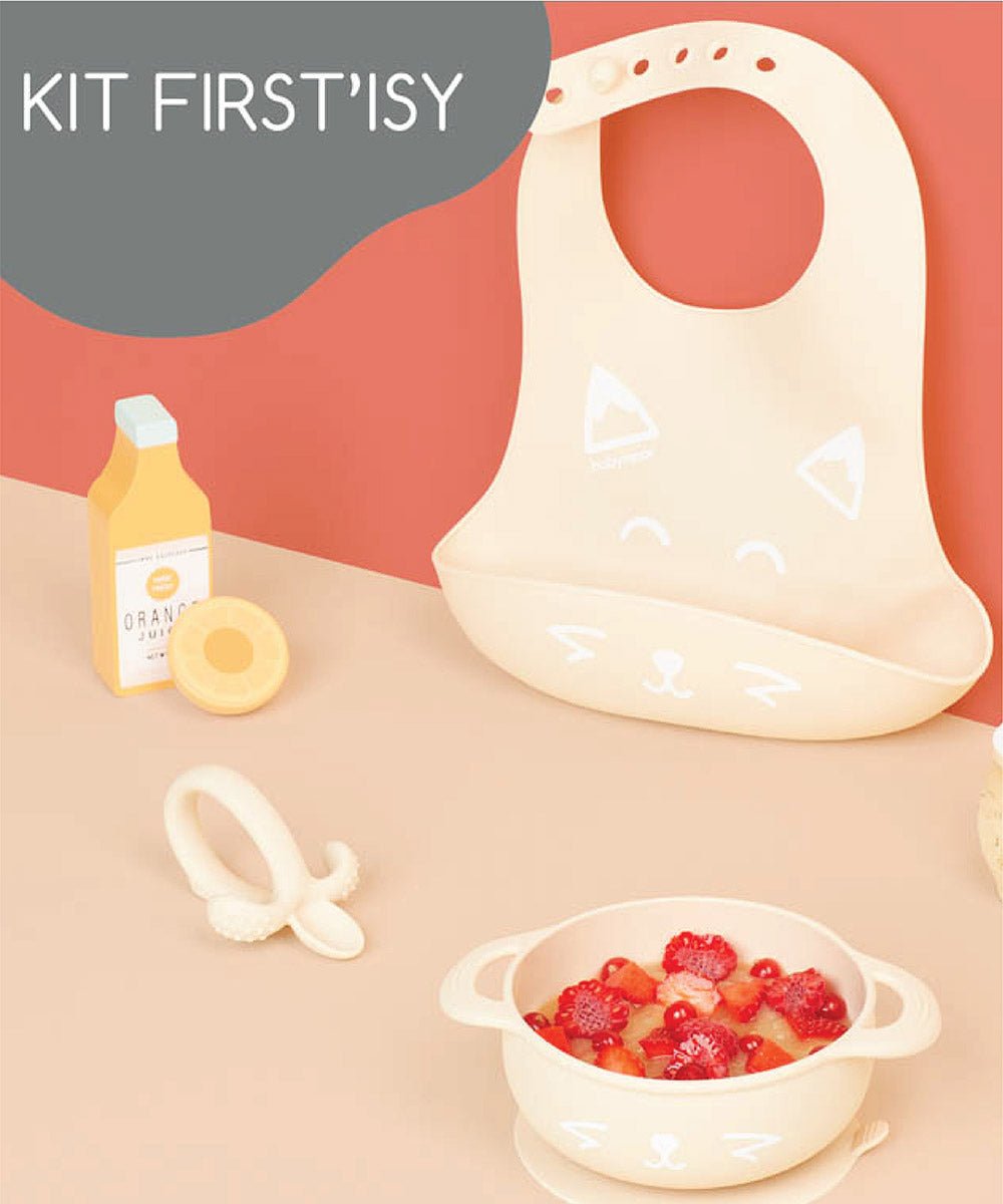 Beige silicone bowl with fruit, matching bib and feeding spoon set