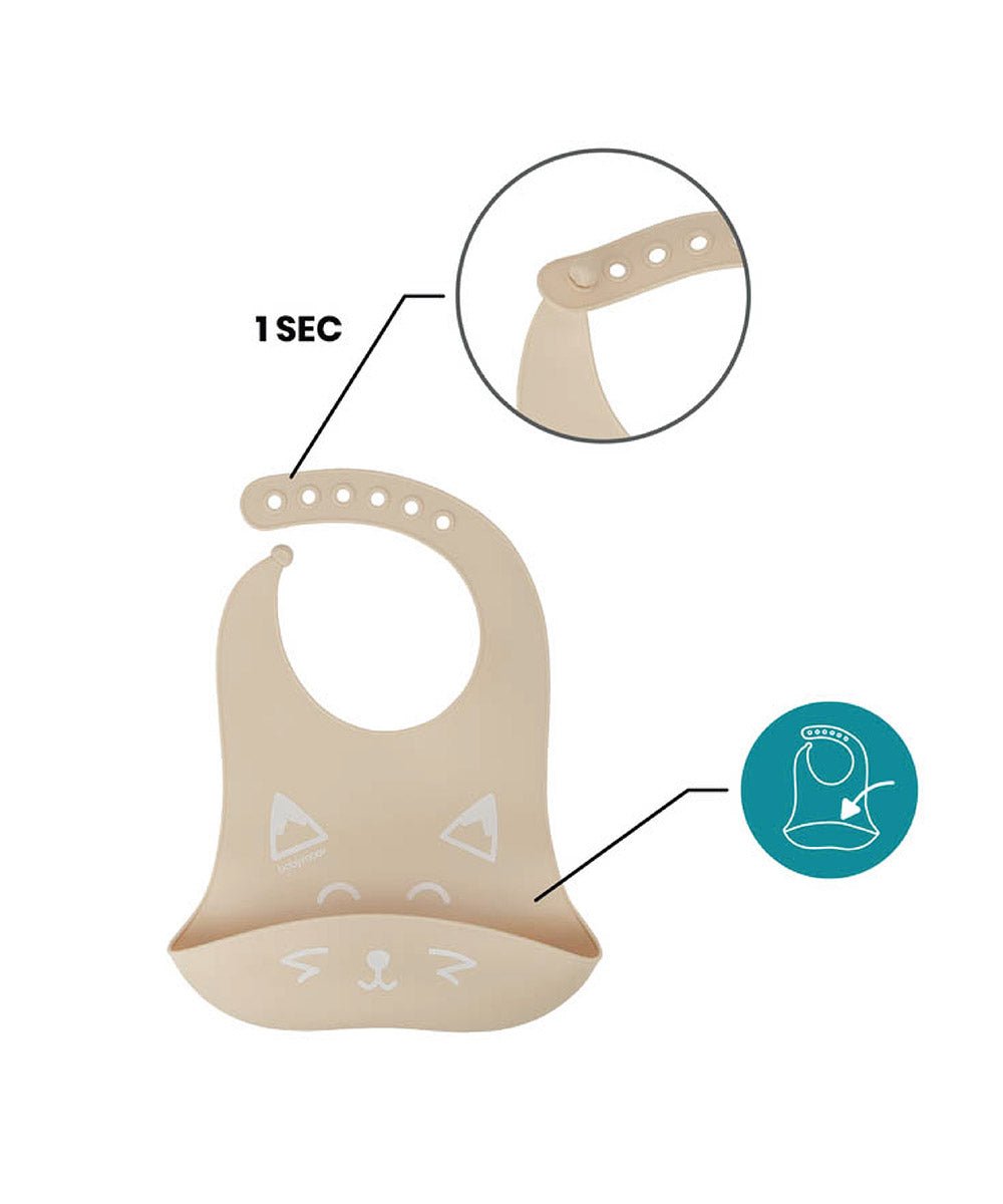 Beige silicone baby bib with cat face pattern and hanging loop, with spoon