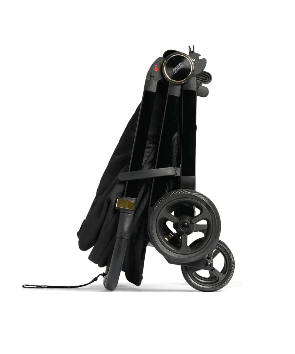 Black stroller with canopy, large wheels, and side storage strap