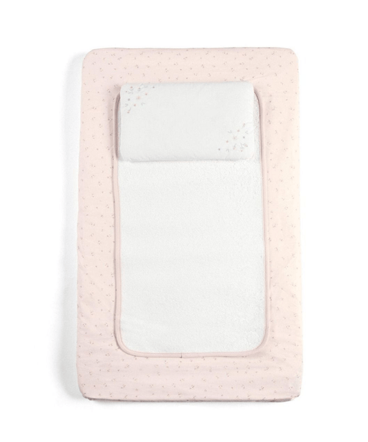 Pink changing mattress with speckled cover and white padded insert